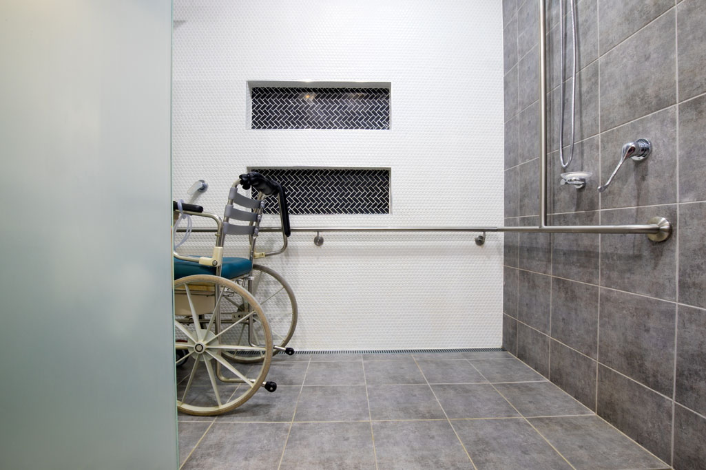 modified bathroom with handrails for wheelchair
